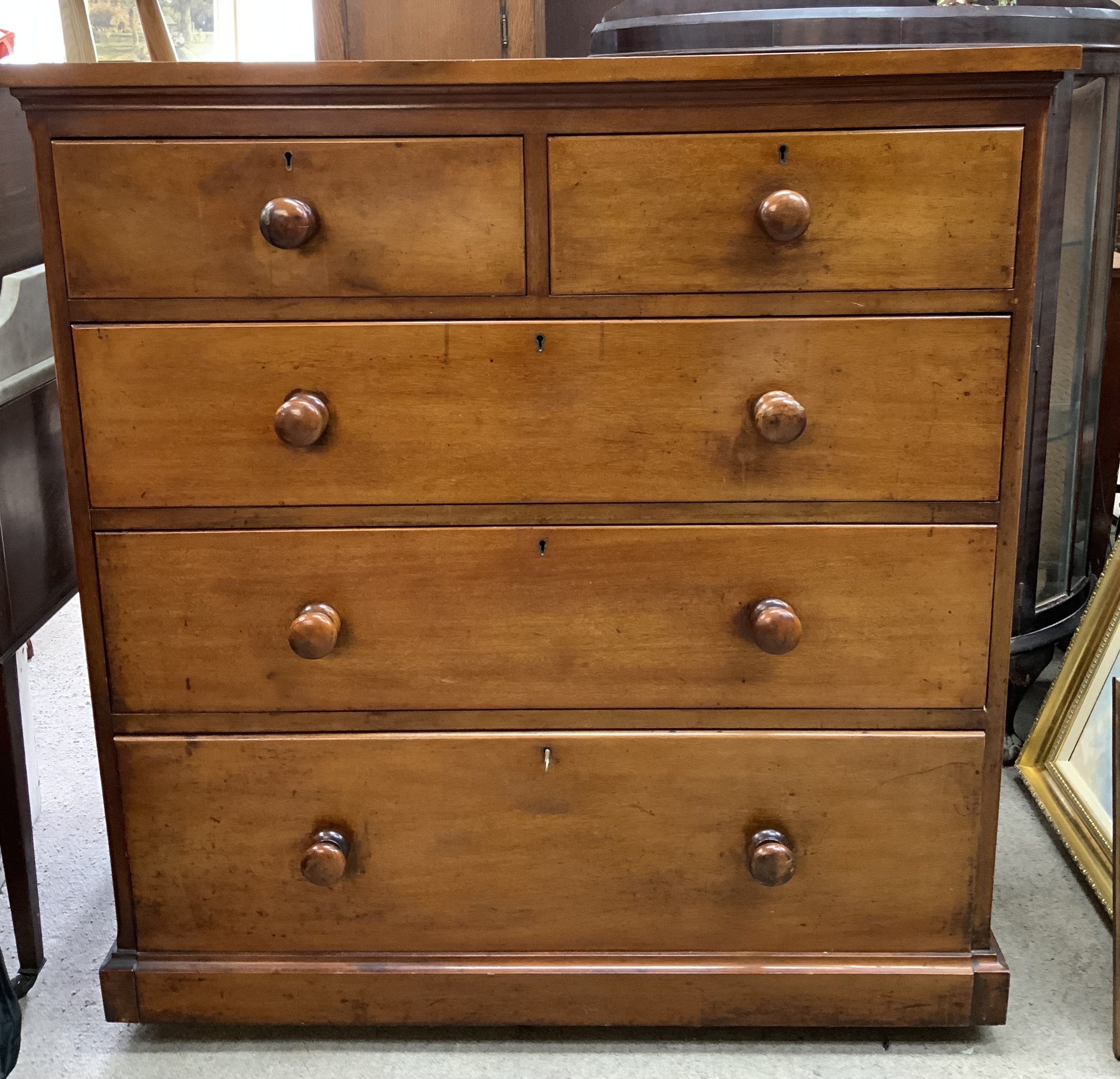 A Victorian chest of drawers with linen drop flap