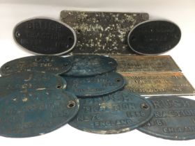 A collection of train and carriage plates, a large train engine piston, a lamp etc. Shipping