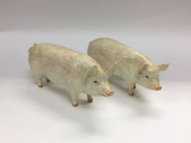 Two Beswick figures of pigs, one has a chipped ear