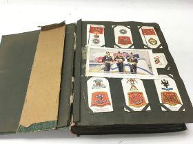 An album containing a large number of vintage cigarette cards.