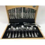 A canteen of cutlery and a Victorian silver spoon