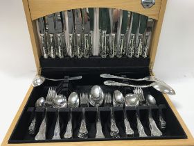 A canteen of cutlery and a Victorian silver spoon