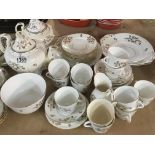 A Victorian tea set white glazed and decorated wit