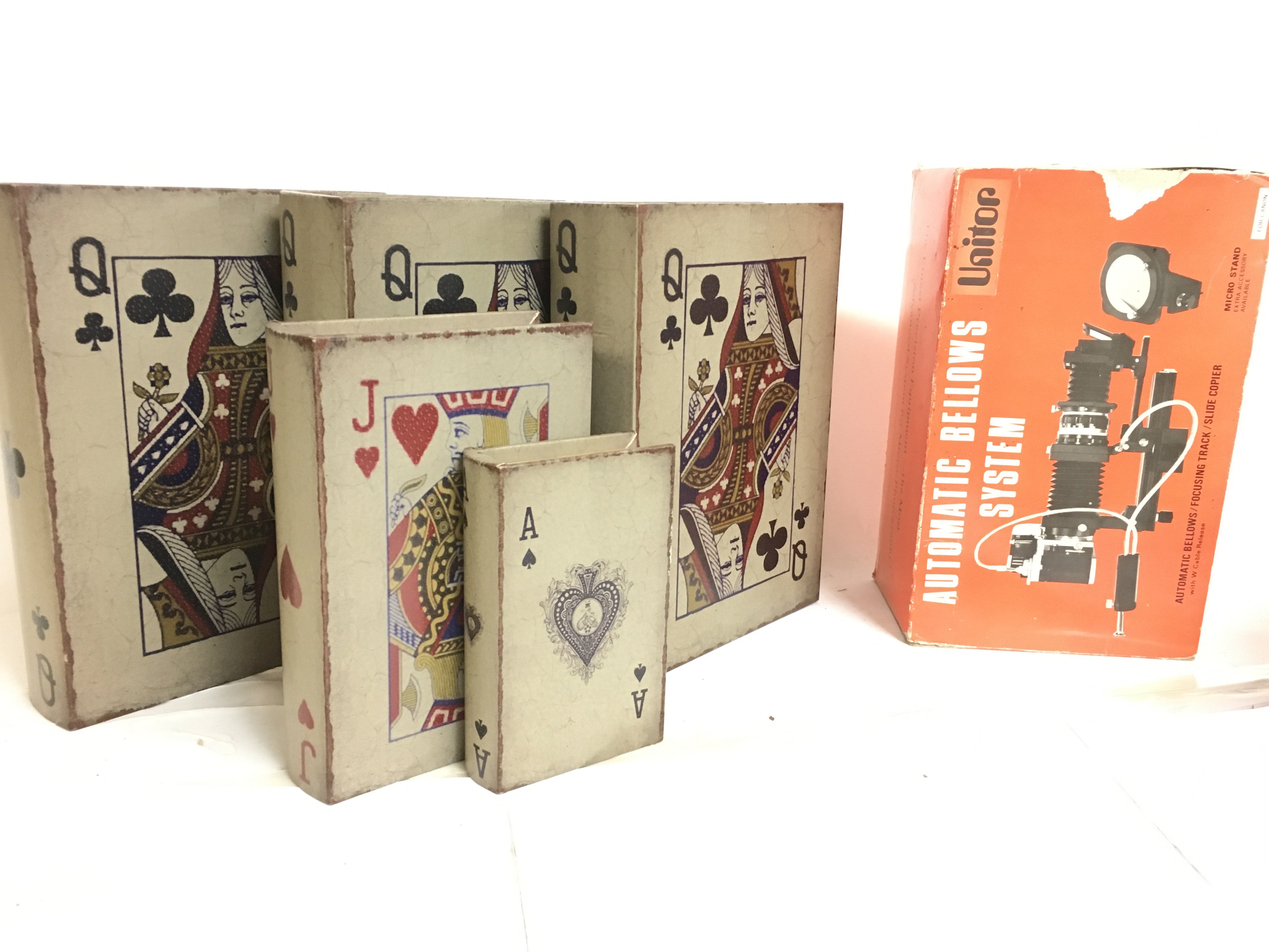 A collection of playing card style boxes and a vintage boxed Unitor Automatic Bellows System. This