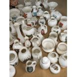 A collection of Goss Crested china small vases and