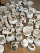 A collection of Goss Crested china small vases and