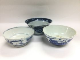 Three blue and white Oriental bowls, largest diame