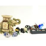 A collection of ceramic elephant ornaments includi