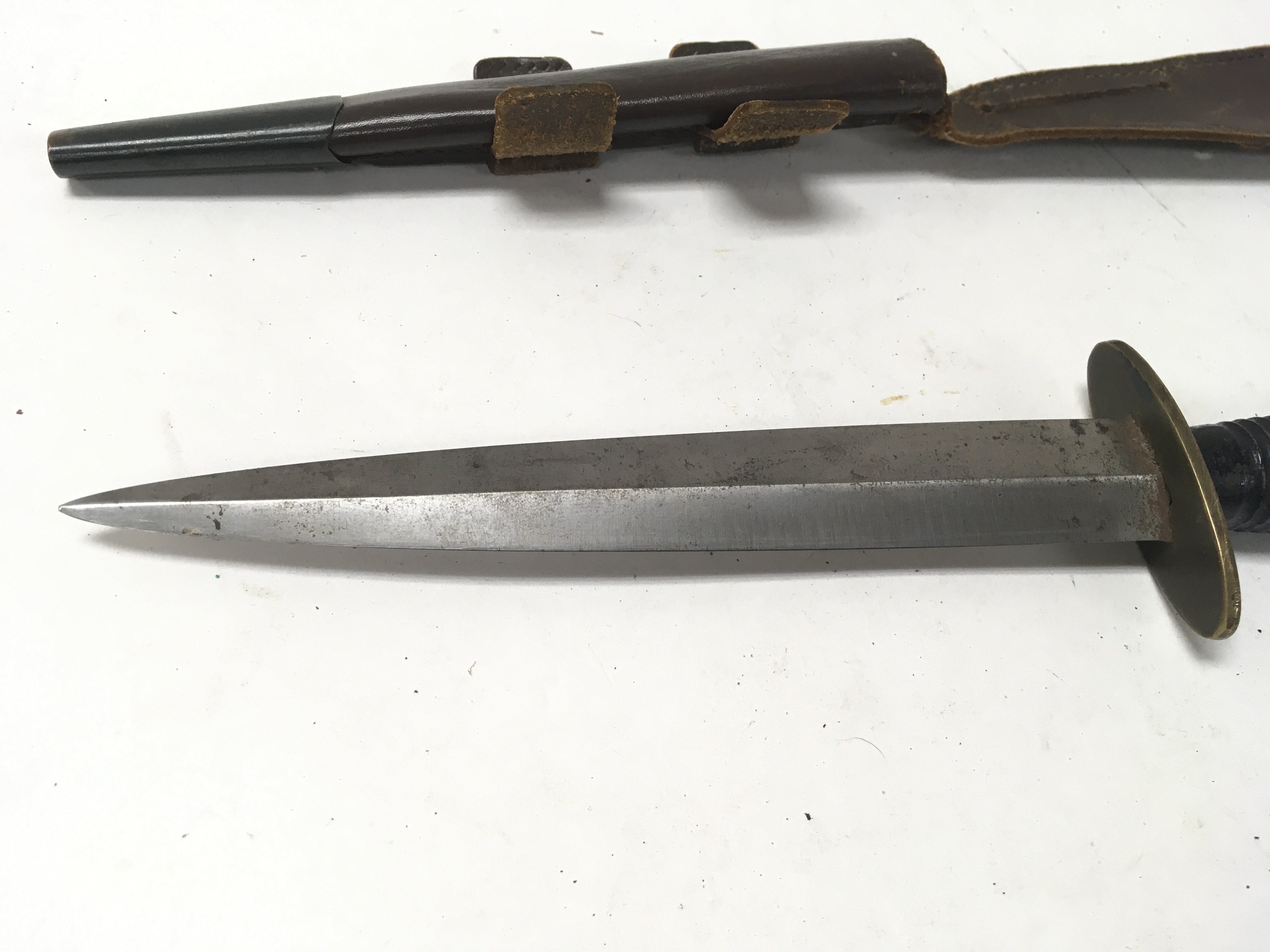 A Fairbairn Sykes fighting knife with leather scab - Image 3 of 5