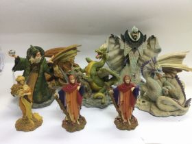 A collection of boxed Enchantica dragons, wizard a