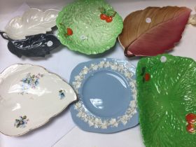 A collection of ceramic plates including wedgewood
