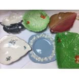 A collection of ceramic plates including wedgewood