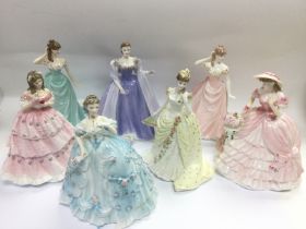 Seven ceramic figures of ladies comprising Coalpor