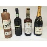 A bottle of 1990 Vintage Port a bottle of Canadian Club Whisky a bottle of Raymond Boulard Champagne