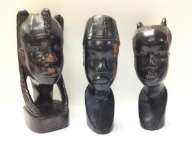 Carved wooden tribal head statues, 24cm tall appro