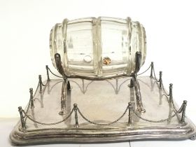 A silver plated tray fitted with a glass barrel de
