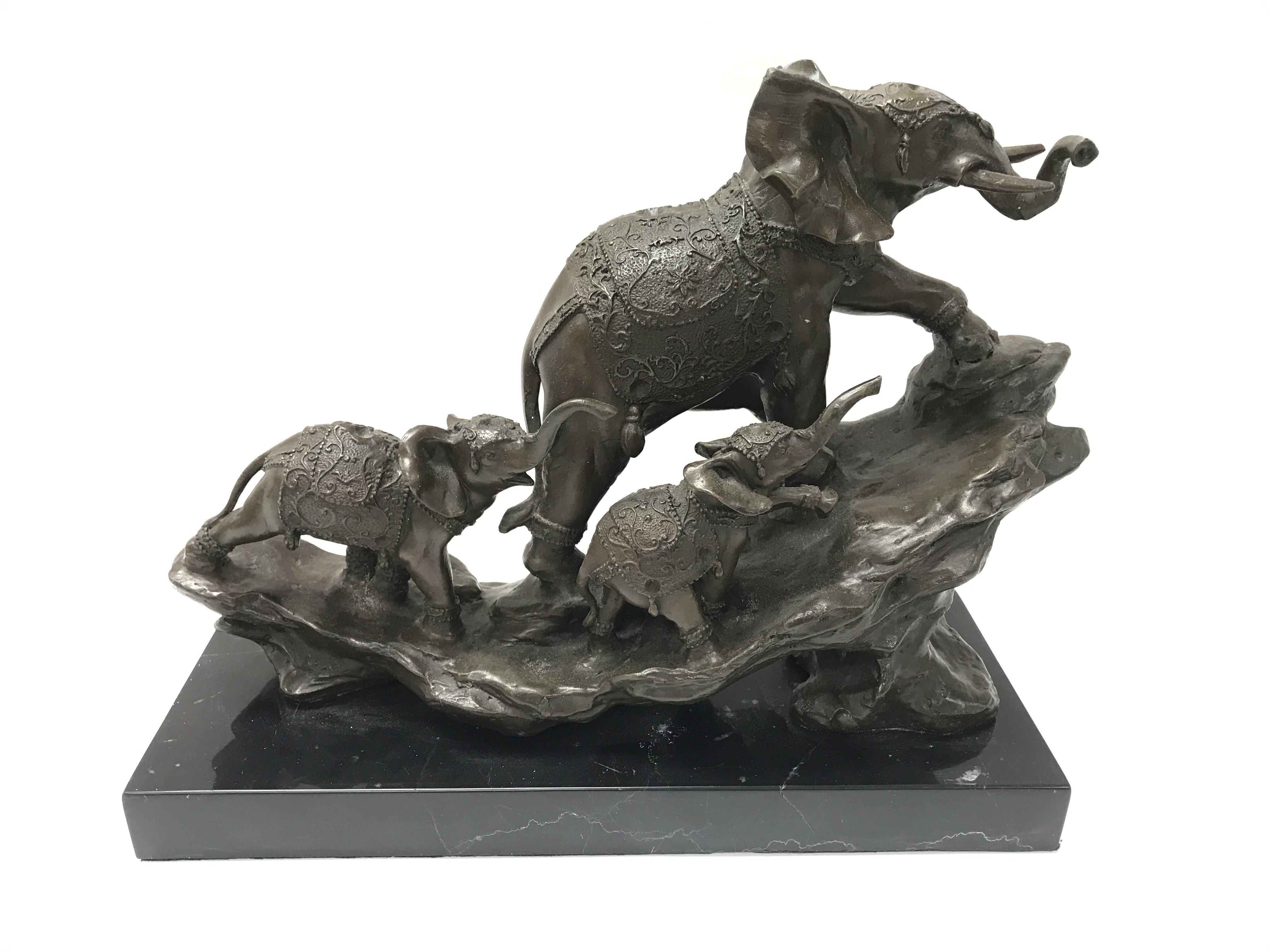 A modern cast bronze elephant figure on a stone ba