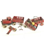 A vintage tin plate toy truck with extras. This lo