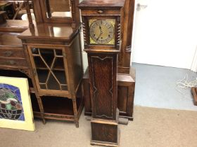 An oak granddaughter clock which has been converte