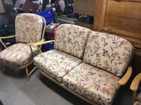 A mid 20th century blonde Ercol three piece suite