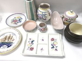 A collection of assorted items of poole pottery.