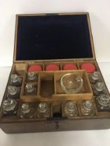 A leather cased apothecary box with a well fitted