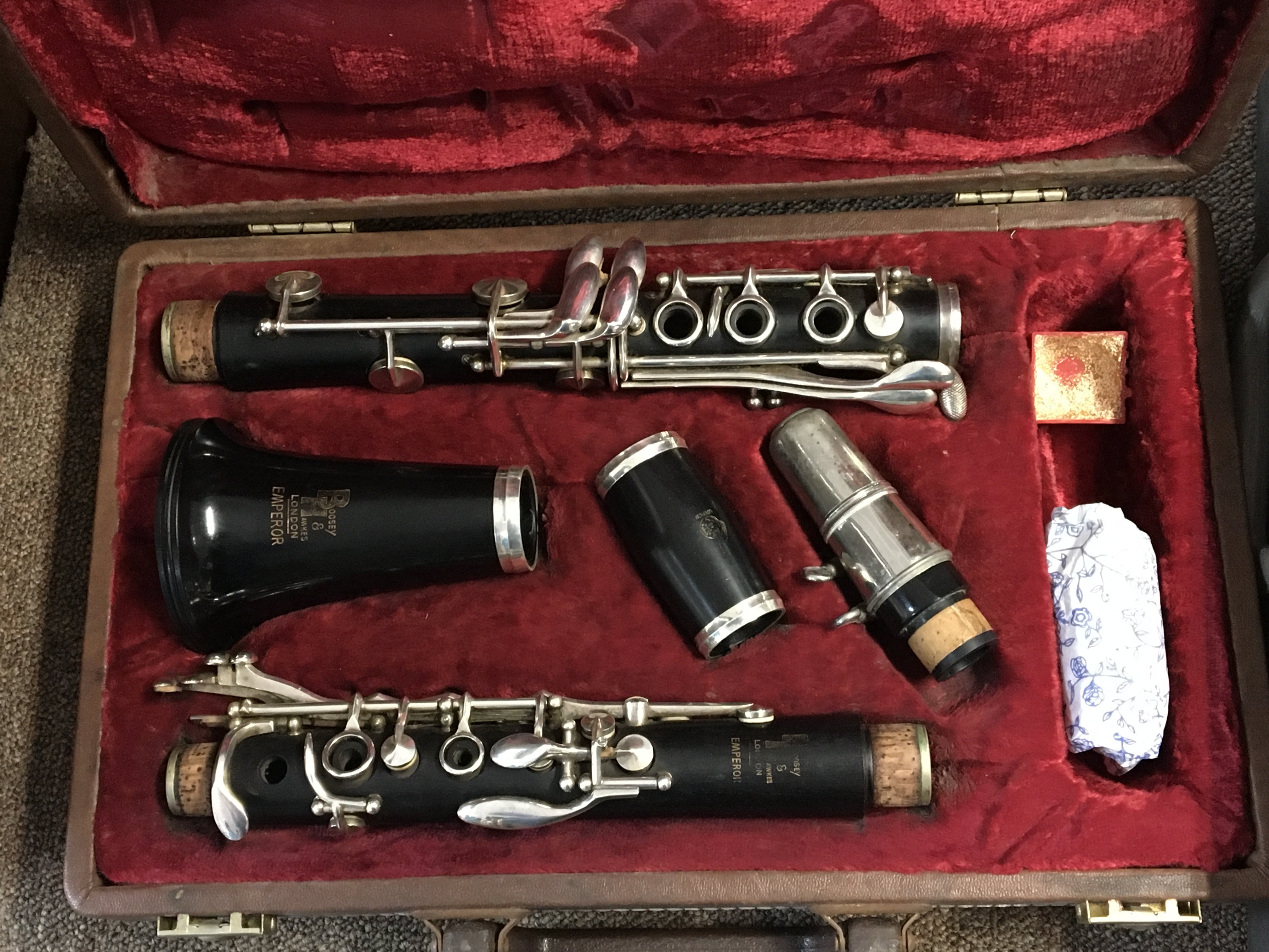 A Boosey and Hawkes Emperor clarinet in a fitted case and a brass trumpet (2)