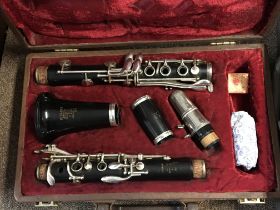 A Boosey and Hawkes Emperor clarinet in a fitted case and a brass trumpet (2)