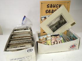 A collection of postcards in two boxes including m