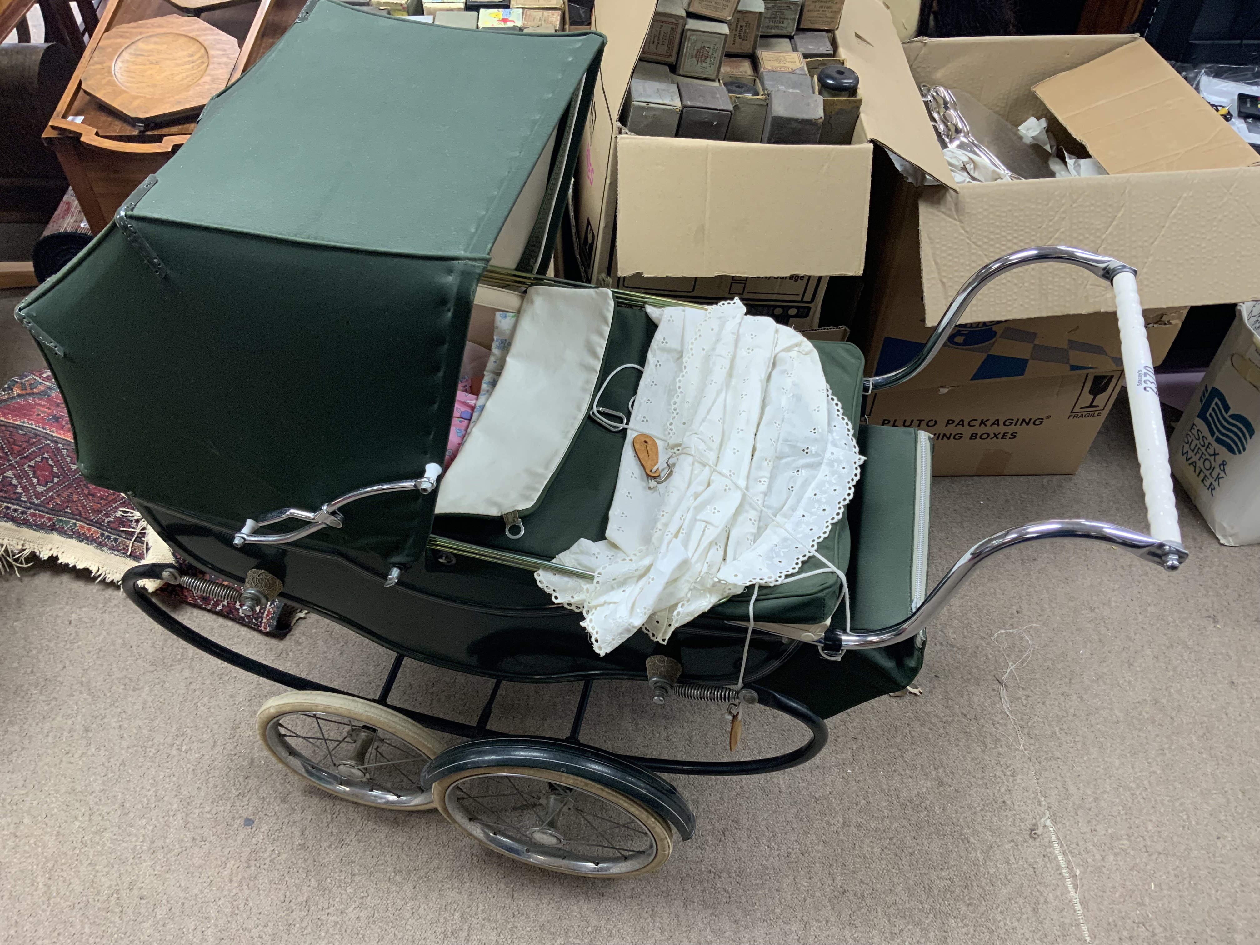 A vintage 1950s Marmet dolls pram and accessories.