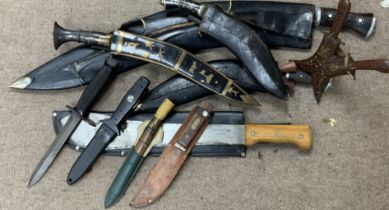 A collection of vintage knives and Kukri. (D)