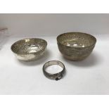 Two silver bowls and one silver bangle.