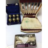A box of silver plated cutlery and other oddments.