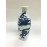 A blue and white vase decorated with a dragon and