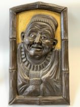 A 20thC Japanese Guardian carved wooden panel inse