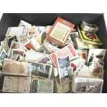 A box of cigarette cards including Churchman, Chai