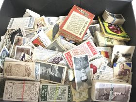 A box of cigarette cards including Churchman, Chai