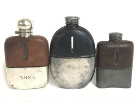 Three vintage leather bound hip flasks