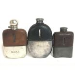 Three vintage leather bound hip flasks