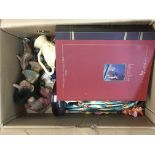 An assortment of figures including Disney Snow White music box figure, lady and the trail boxed