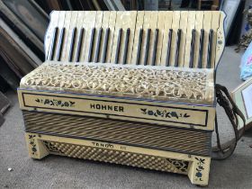 Two Hohner accordions including a Hohner Tango III and a cased Hohner. This lot cannot be posted