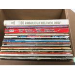 A box of LPs by various artists including Elvis Pr