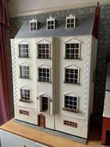 An Impressive dolls house modelled upon a Mid-Vict