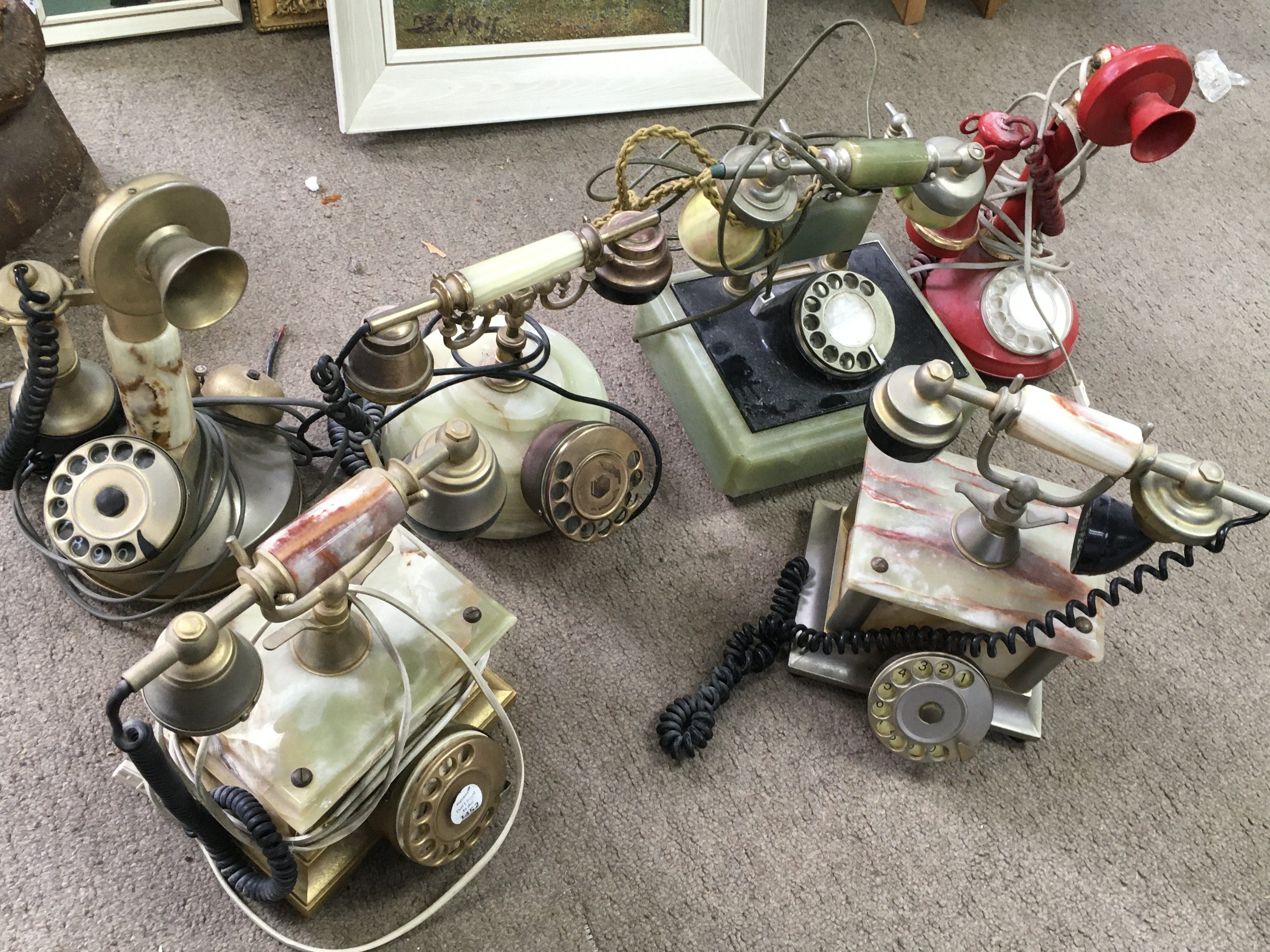 A collection of vintage telephones including marble examples. This lot cannot be posted