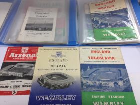 Two folders of football programs including 1950s a