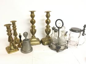 Bronze candlesticks, bells, and a Benetfink & Co s