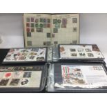 A collection of stamps including some presentation packs, first day covers and stamp albums