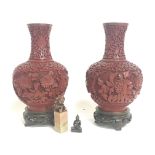 A pair of Chinese Cinnabar Lacquer vases on wooden