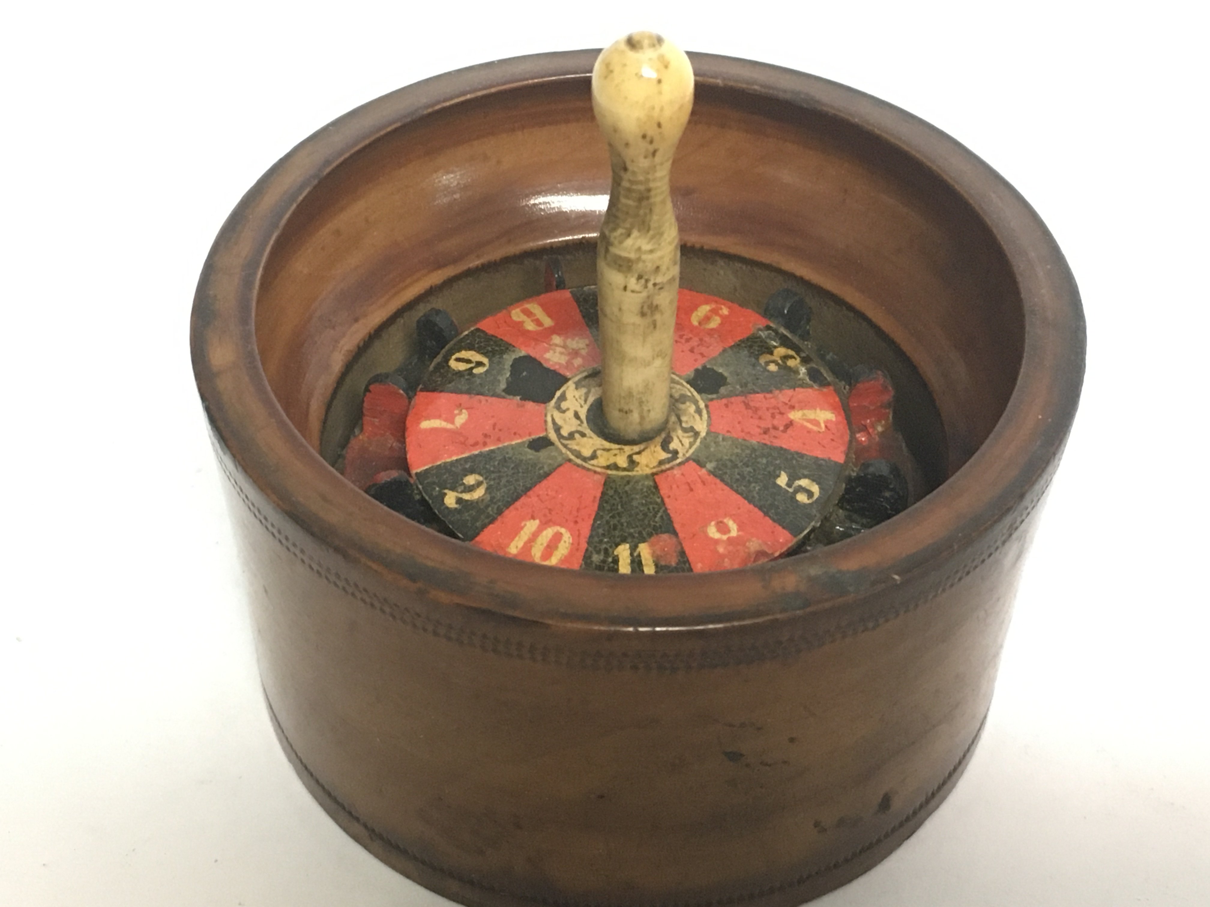 A novelty treen roulette wheel, 8cm tall postage c - Image 2 of 3