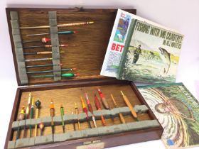 A vintage Box of fishing floats and some books. Po
